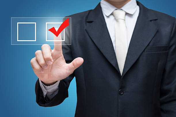 istock Businessman touch checking mark checklist marker Isolated 469588352