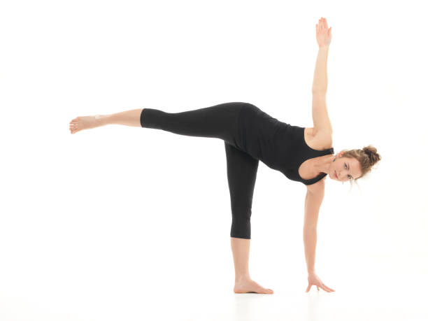 istock young attractive woman in yoga pose 469589109