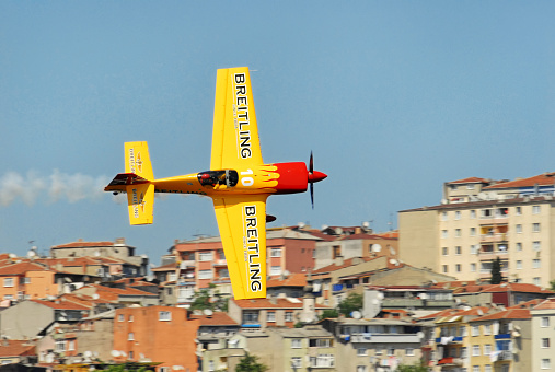 Istanbul, Turkey -  June 2, 2006: Aeroplane of Breitling Team making aerial acrobatic moves during Red Bull Air Race in Istanbul, Turkey.