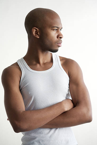 istock Attractive young man standing with arms crossed 469594321