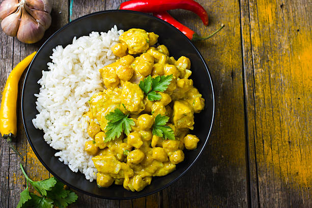 istock Spicy chicken and chickpeas curry and rice 469594598