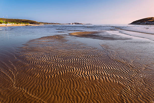 istock SUMMER.Gargano coast: low tide at dawn. Vieste (Puglia)- ITALY- 469595773