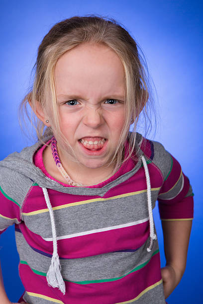 istock Little girl looking angry 469597384