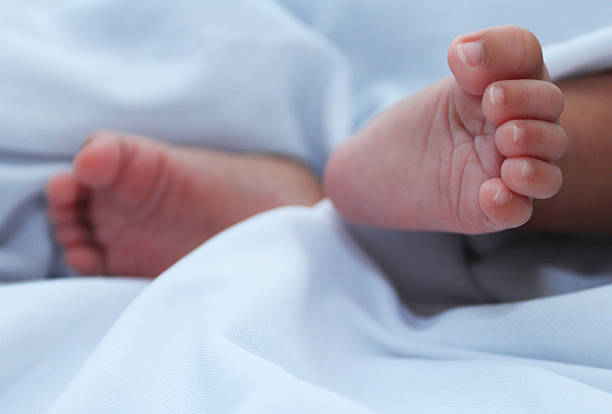 istock One month old babies feet 469597575