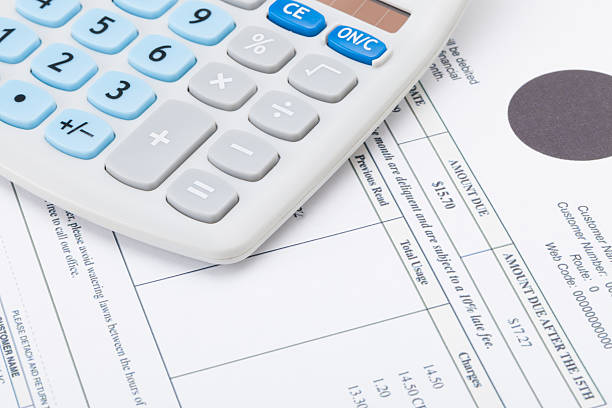 istock Calculator with monthly utility bill under it 469600634