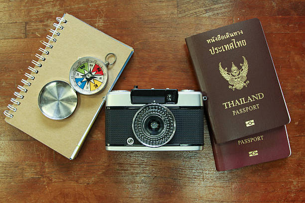 istock Outfit of traveler, Different objects on wooden background. 469600812
