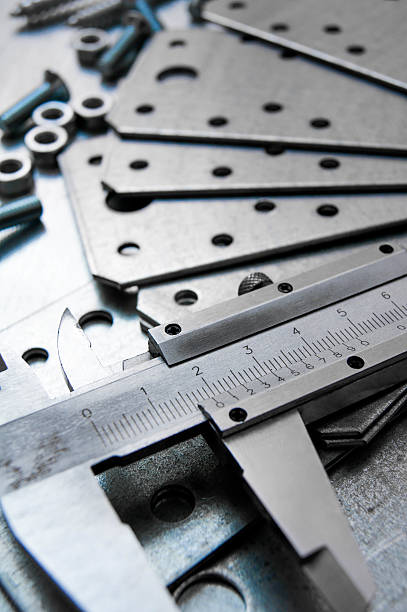 istock Calliper, blank and screws on the scratched metal background 469603822
