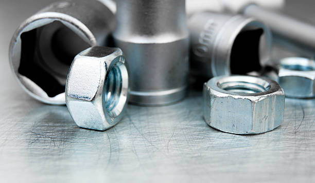 istock Wrench heads and nuts on scratched metal background 469603978