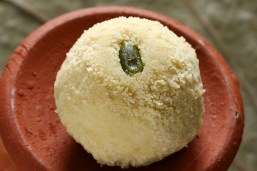 Kheer kadam is a delectable Bengali sweet which has a moist rosogolla centre surrounded by sandesh
