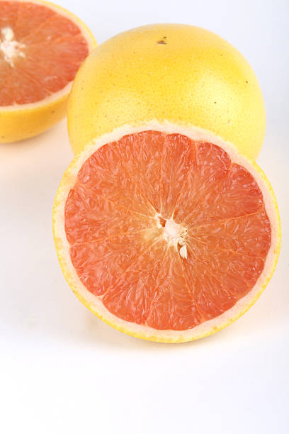 istock Tasty ripe grapefruits on white background 469606937