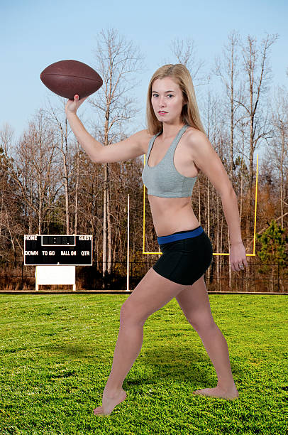 istock Woman Playing Football 469608505