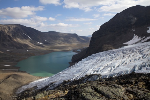 Walking from Singi through gubbevagge and passing Kebnekaise, and the most southern of it's glaciers Tarfala at last turns up in the distance. An amazing sight. Lapland, Northern Sweden, Kebnekaise.