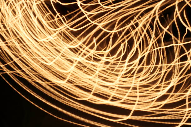 istock Abstract blurred swirl light lines on dark background 469617670