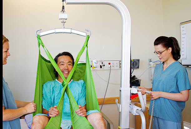 istock Getting patient out of bed with lift 469617799