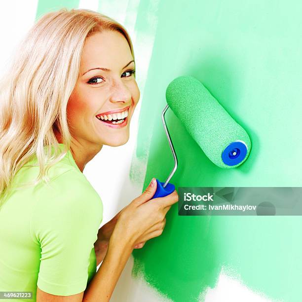 Woman Painting The Wall Stock Photo - Download Image Now - Paint, Adult, Adults Only