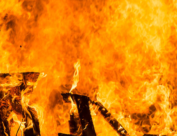 istock yellow orange and red fire flames burning as background 469626150