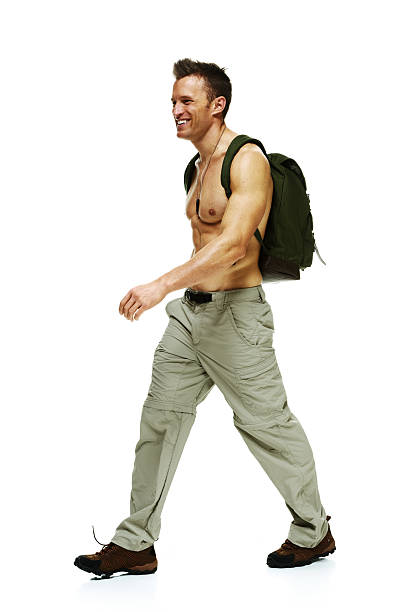 istock Smiling male hiker walking and looking away 469631594