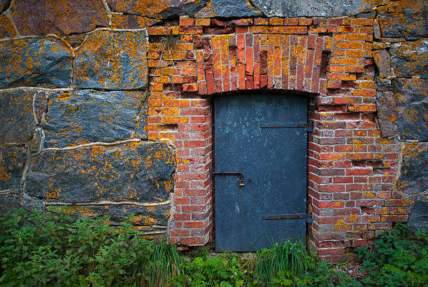 istock The door with lock in an old stone wall 469631898