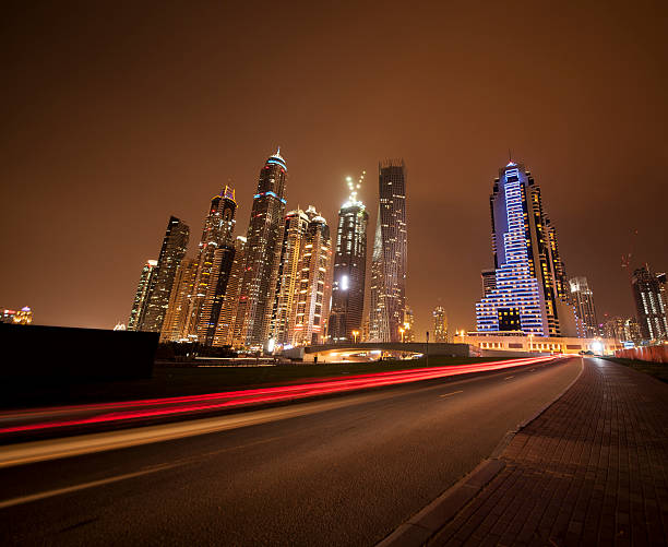 NIght view towards Dubai marina and light trails in red. Image is taken during Dubai Istockalypsse