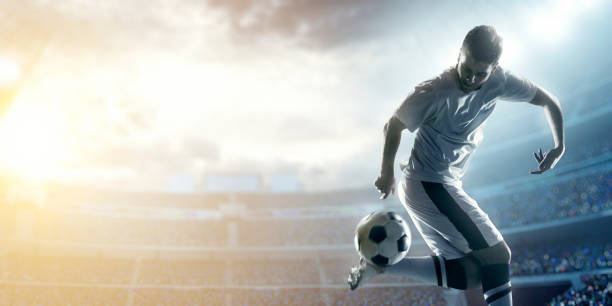 istock Soccer player kicking ball behind his back in the stadium  469634814