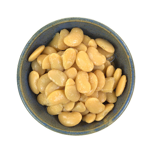 istock Bowl of butter beans on white background 469635190