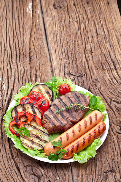 istock Grilled steak,sausages and vegetables. 469638482