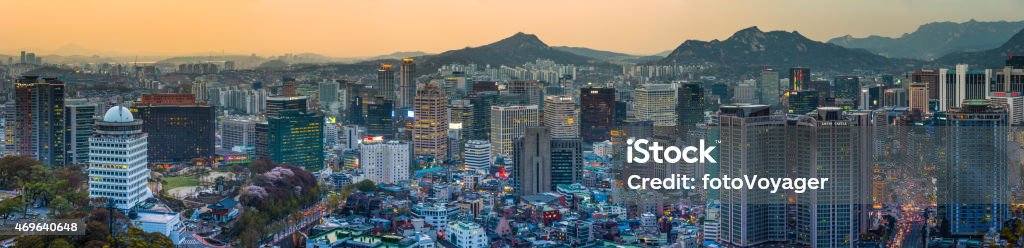 Seoul neon lights crowded cityscape panorama over downtown sunset Korea Sunset sky glowing over the futuristic skyscrapers and crowded cityscape of downtown Seoul, South Korea. ProPhoto RGB profile for maximum color fidelity and gamut. Mapo-gu Stock Photo