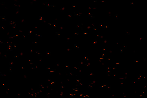 Chispas de fuego aislada sobre fondo negro photo