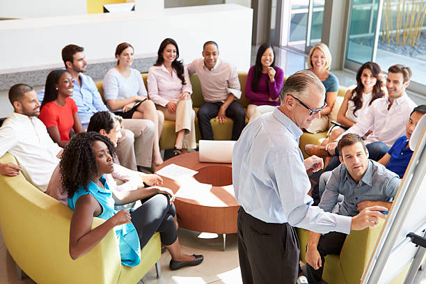 istock Businessman Making Presentation To Office Colleagues 469641821