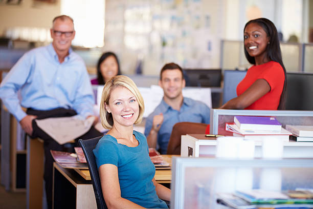 istock Businesspeople in modern office smiling at camera 469641897