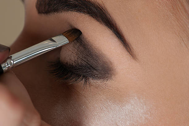 istock makeup artist working with the eye make-up brush 469641980