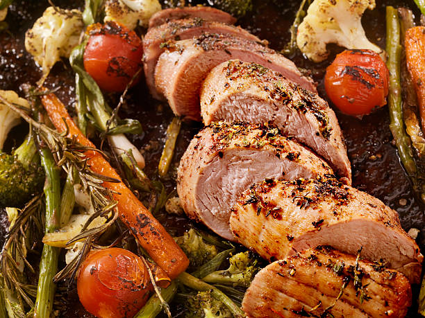 Roasted Pork Tenderloin Perfectly Roasted Pork Tenderloin with Roasted Vegetables-Photographed on Hasselblad H3D2-39mb Camera asparagus photos stock pictures, royalty-free photos & images