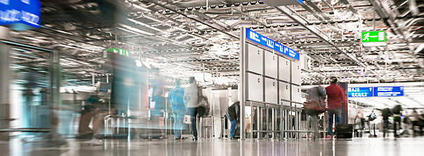 istock People in the airport. Motion blur. 469642628