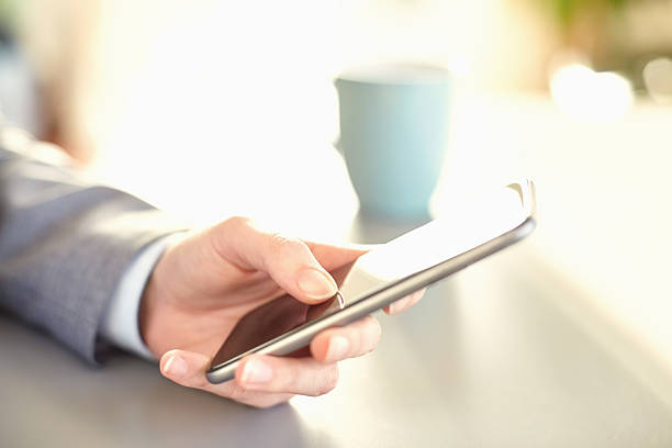 istock Businesswoman's hand texting on smart phone 469645374