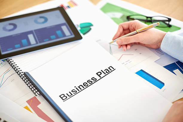 istock Businesswoman preparing business plan at desk 469645448