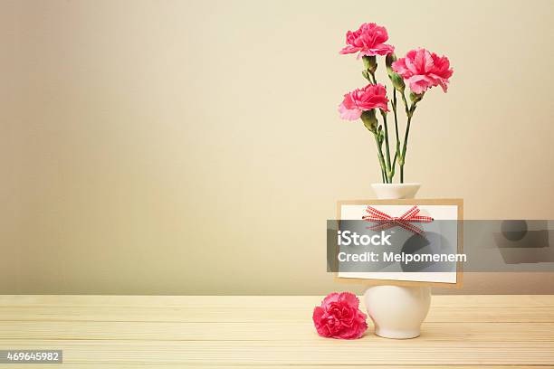 Pink Carnations On White Vase With Blank Greeting Card Stock Photo - Download Image Now