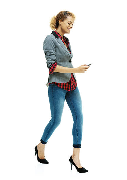 istock Smiling casual woman using mobile 469646470