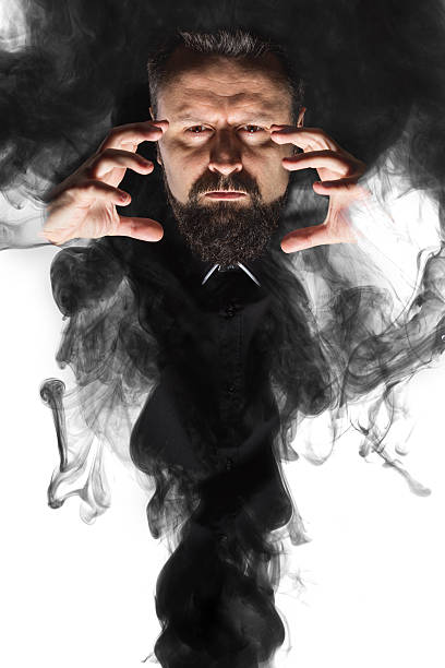 istock Magician appearing out of smoke 469648836