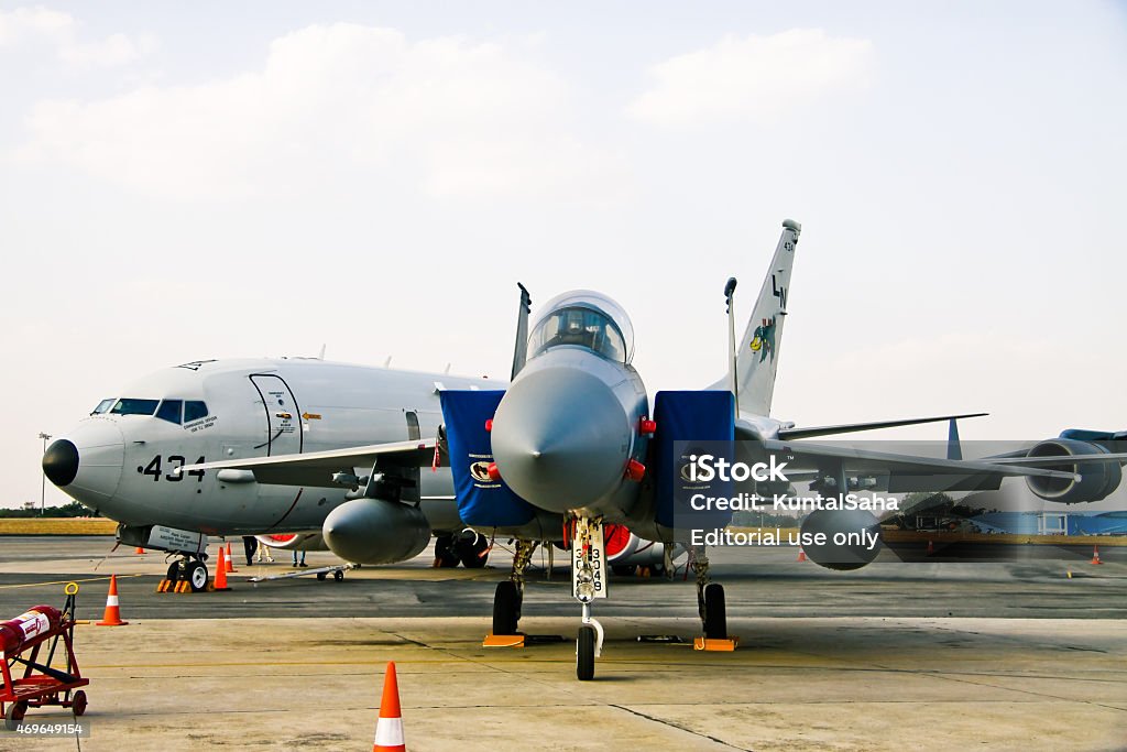 F-16C Fighting Falcons Bangalore, Karnataka, India - February 20, 2015: F-16C Fighting Falcons on static display in Aero India 2015 and Boeing P-8A in background. The tenth edition of Aero India was held from 18th to 22nd February 2015. The main attraction of this year was the Make in India campaign by Prime Minister Narendra Modi. A total of 72 aircraft were part of the air show. The main attraction of the event was the fly past and demonstration by HAL Tejas, HAL Light Combat Helicopter, Sarang display team and air display teams from Sweden, UK, Czech Republic and Open sky jump by US Special forces. A total of 11 foreign military aircraft on display, out of which a majority of them from the United states including two F-15C Eagles, two F-16C Fighting Falcons, one Boeing KC-135 tanker, one C-17 Globemaster III and a P-8A Poseidon maritime surveillance aircraft. Narendra Modi Stock Photo