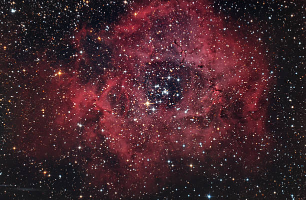 istock Red nebula Rosette in a dark night sky 469649263