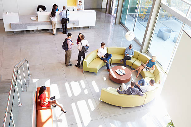 istock Reception Area Of Modern Office Building With People 469650153