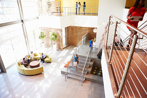 istock Reception Area Of Modern Office Building With People 469650371