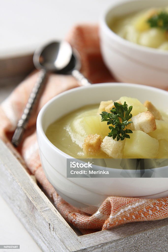 Creamy sweet potato soup with croutons and parsley Creamy sweet potato soup with croutons and parsley in white bowl Appetizer Stock Photo