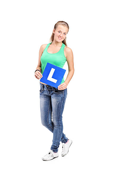 istock Young girl holding an l sign 469652160