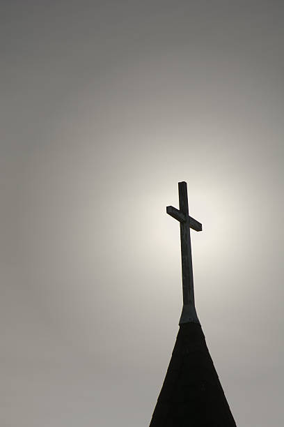 istock Church Steeple, Cross, Sunset with the cross highlighted 469654870