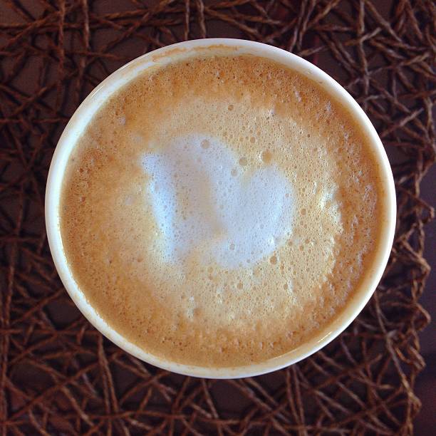 Latte with steam milk in cup