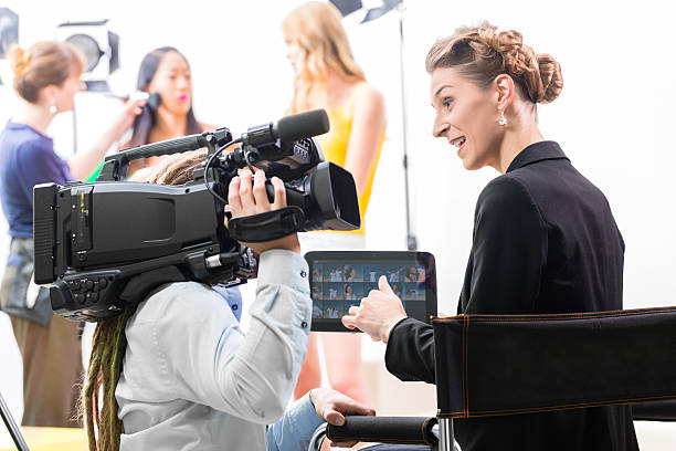 istock Director giving cameraman direction for video production 469656025