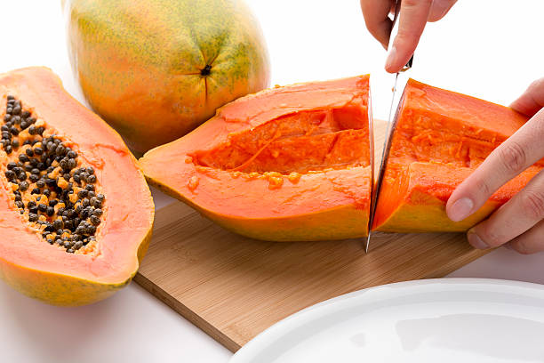 istock First Cut Through A Hollowed Out Papaya Half 469657338