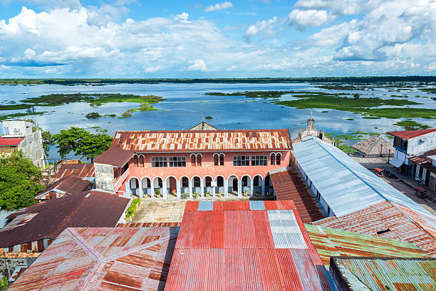 Iquitos City and River View View of Iquitos, Peru with the Itaya River in the background in the Amazon Rainforest.  Iquitos is the largest city in the world with no road connection. iquitos photos stock pictures, royalty-free photos & images