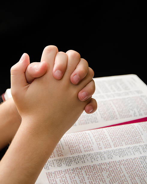 istock Hands of a Child Clasped in Prayer 469661661